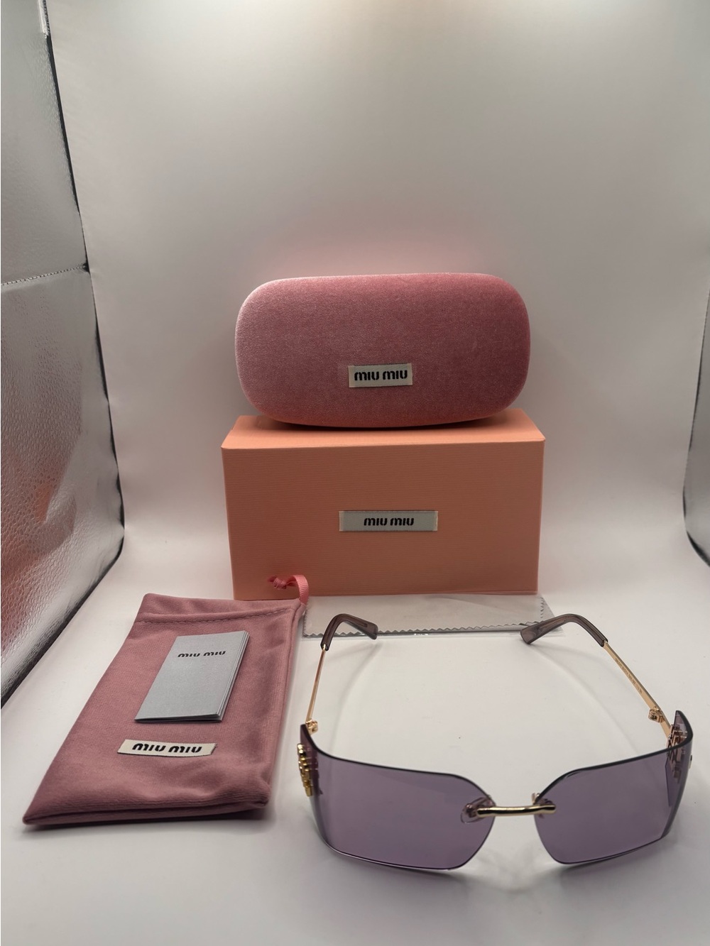 Miu Miu Women's Rimless Sunglasses - Pink Lenses